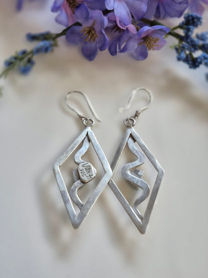 Serpent’s Embrace Earrings - Wood Bison Metal